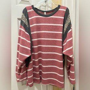 Pink and white striped with gray, cheetah print sweater. Size medium